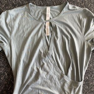 Women’s size 6 Light Blue Lululemon Cross body Short Sleeve Shirt